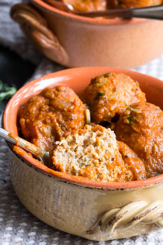 Savory pumpkin turkey meatballs in a creamy, dairy-free, paleo and Whole30 harvest tomato sauce with pumpkin and spices.  Makes a cozy, healthy and filling dinner and the leftovers are great for a next-day lunch.  Gluten-free, grain-free, kid approved and easy to make!