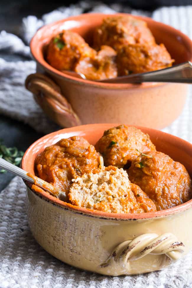 Savory pumpkin turkey meatballs in a creamy, dairy-free, paleo and Whole30 harvest tomato sauce with pumpkin and spices.  Makes a cozy, healthy and filling dinner and the leftovers are great for a next-day lunch.  Gluten-free, grain-free, kid approved and easy to make!