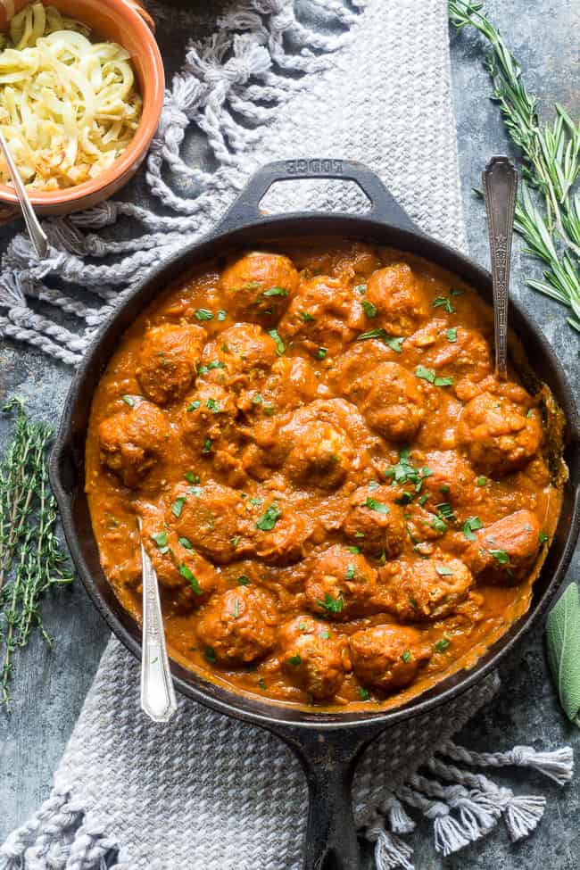 Savory pumpkin turkey meatballs in a creamy, dairy-free, paleo and Whole30 harvest tomato sauce with pumpkin and spices.  Makes a cozy, healthy and filling dinner and the leftovers are great for a next-day lunch.  Gluten-free, grain-free, kid approved and easy to make!