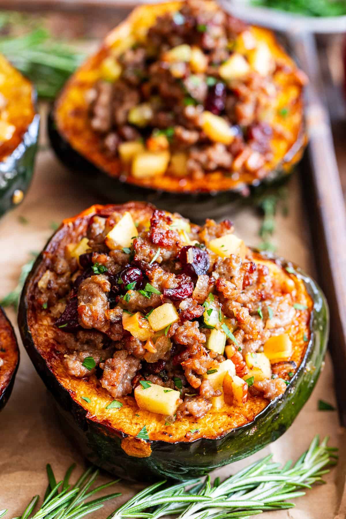 Stuffed acorn squash with sausage apples cranberries and pecans