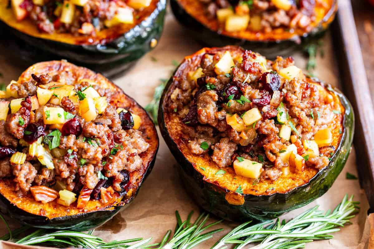 Stuffed acorn squash with sausage apples cranberries and pecans