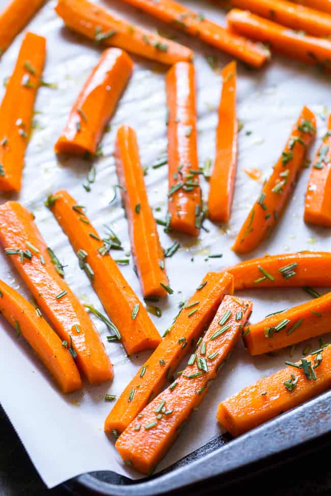 These carrot fries are roasted to crispy perfection with rosemary and tossed with savory crumbled bacon for a fun and healthy appetizer, snack or side dish! Paleo, Whole30 compliant and low carb.