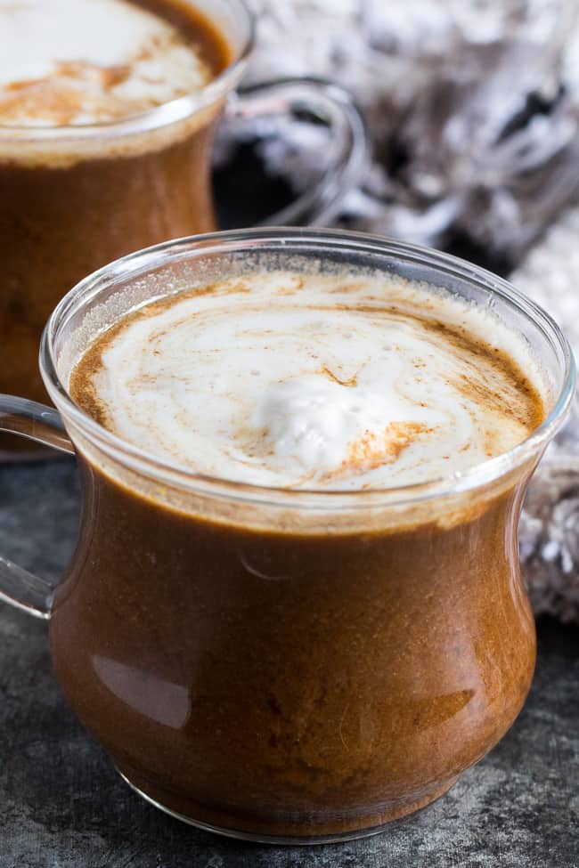 This easy homemade paleo pumpkin spice latte is dairy-free and naturally sweetened with medjool dates.  Add collagen protein for a healthy boost to this cozy and festive latte! #AD #axecollagen @drjoshaxe