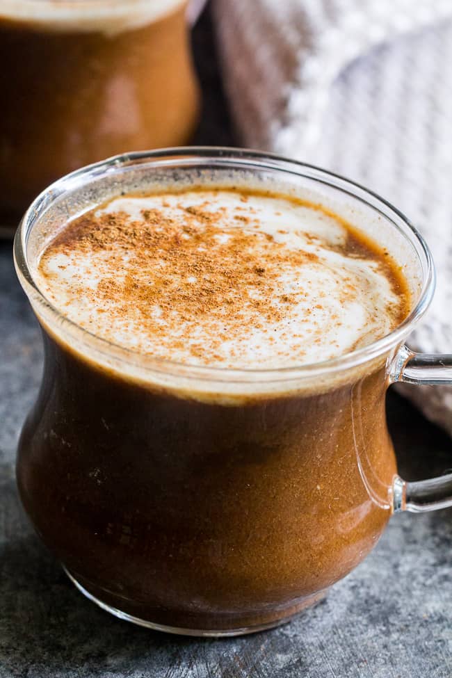 This easy homemade paleo pumpkin spice latte is dairy-free and naturally sweetened with medjool dates.  Add collagen protein for a healthy boost to this cozy and festive latte! #AD #axecollagen @drjoshaxe