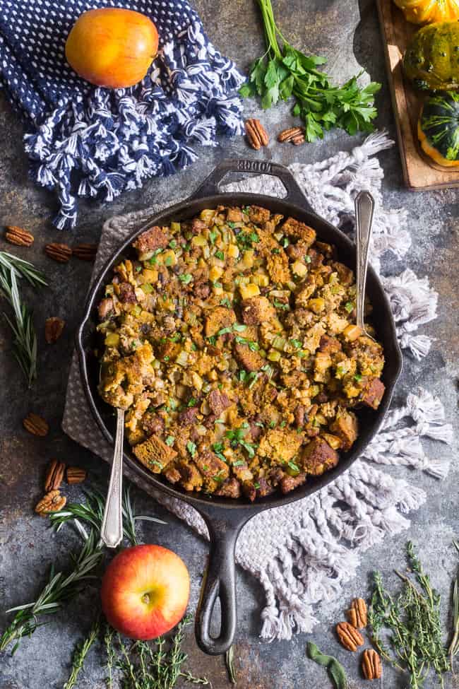 This savory and sweet "cornbread" Paleo Thanksgiving Stuffing is for all of you who want to keep with clean but still crave some bread in your stuffing!  A grain-free, dairy-free sweet potato bread is cubed and baked with sausage, apples, celery and onion, mushrooms, pecans and herbs for a delicious, filling and healthy Thanksgiving stuffing reminiscent of the classic.