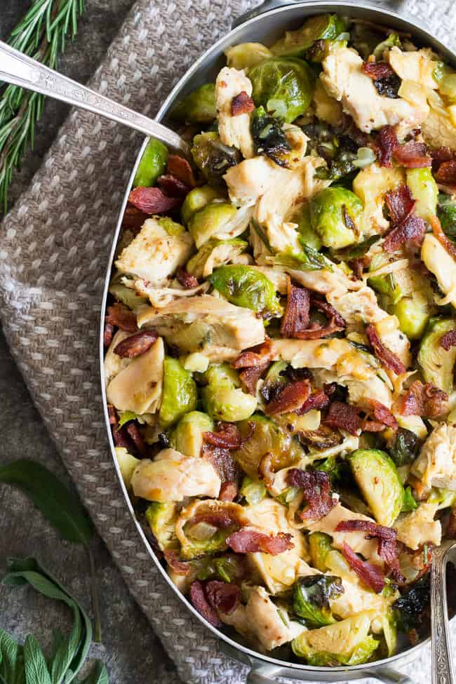 Roasted chicken and brussels sprouts are tossed with crispy bacon and baked in a creamy dairy free sauce for a super comforting, delicious and filling Whole30, paleo, and low carb meal. 