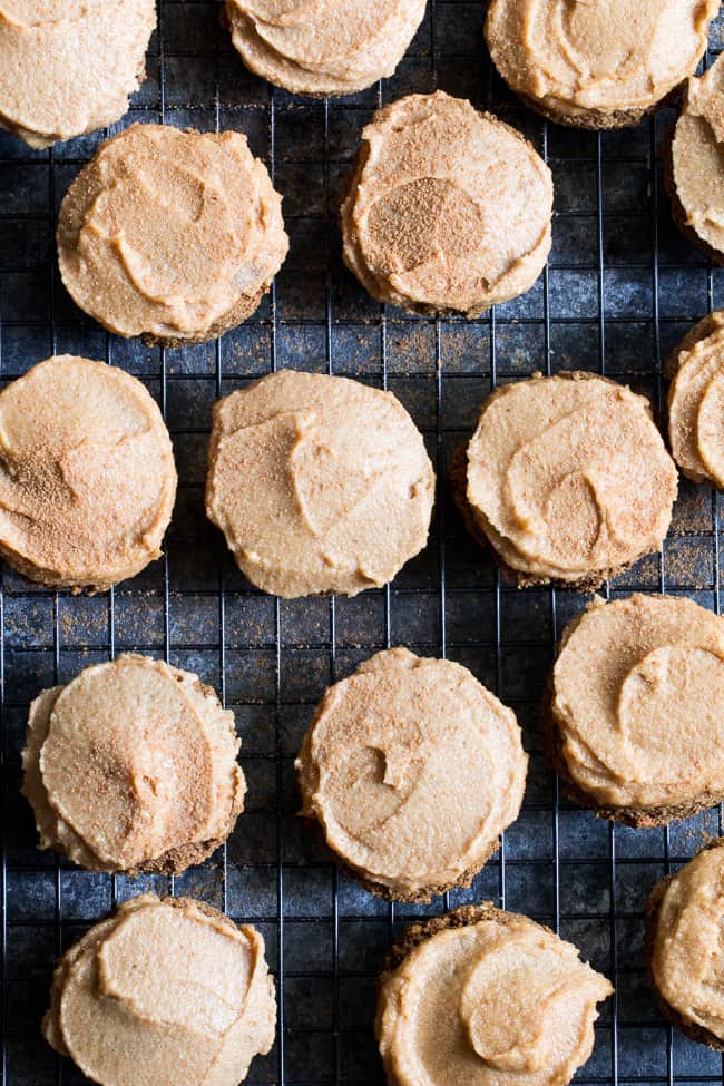 These Paleo Pumpkin Spice Latte Cookies have lots of sweet spice and are topped with a maple cinnamon cashew "cream cheese" frosting! Soft and chewy, gluten-free, dairy-free, vegan option