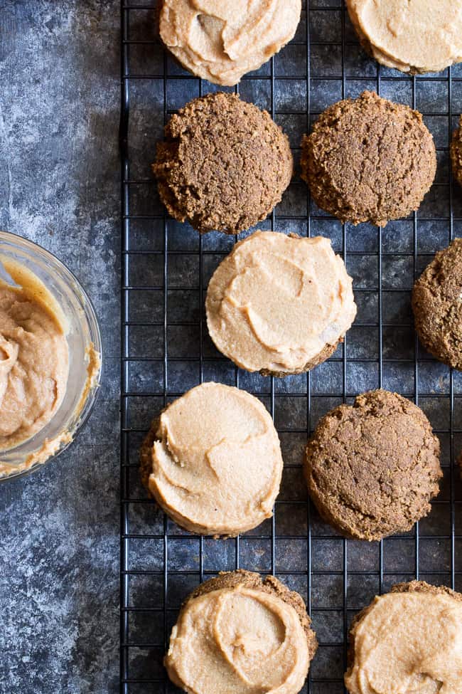 These Paleo Pumpkin Spice Latte Cookies have lots of sweet spice and are topped with a maple cinnamon cashew "cream cheese" frosting! Soft and chewy, gluten-free, dairy-free, vegan option