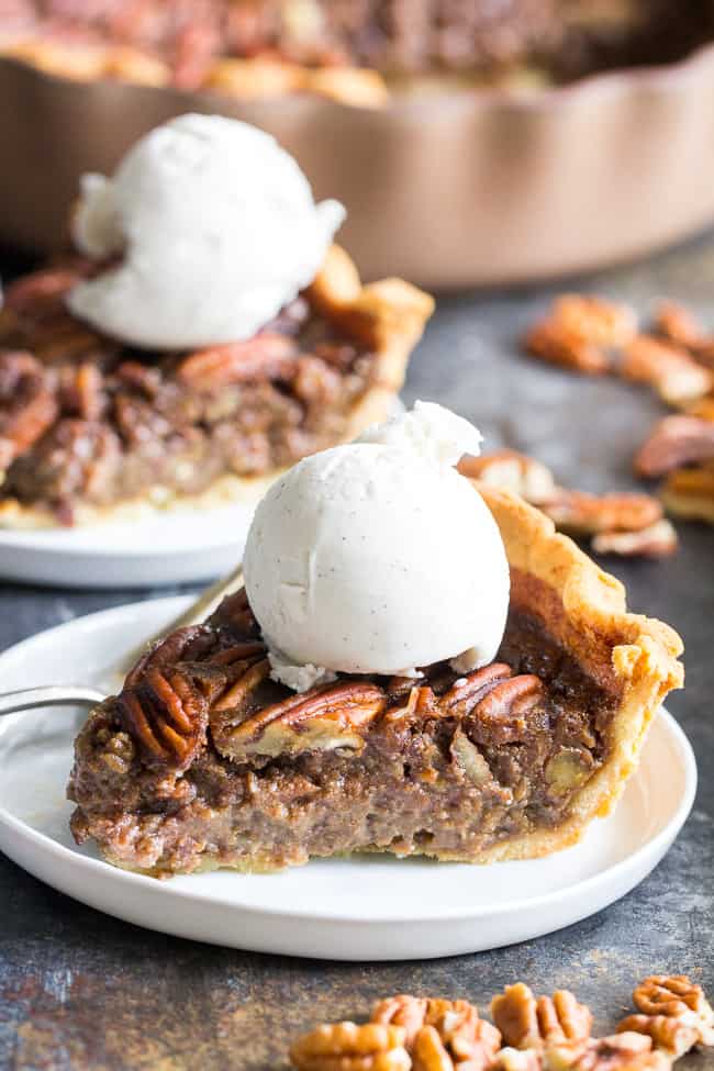 This salted caramel pecan pie is made with an easy dairy free salted caramel sauce and flaky grain free pastry crust (with a dairy-free option) for a rich gooey and sweet paleo dessert for the holidays or any special occasion!  