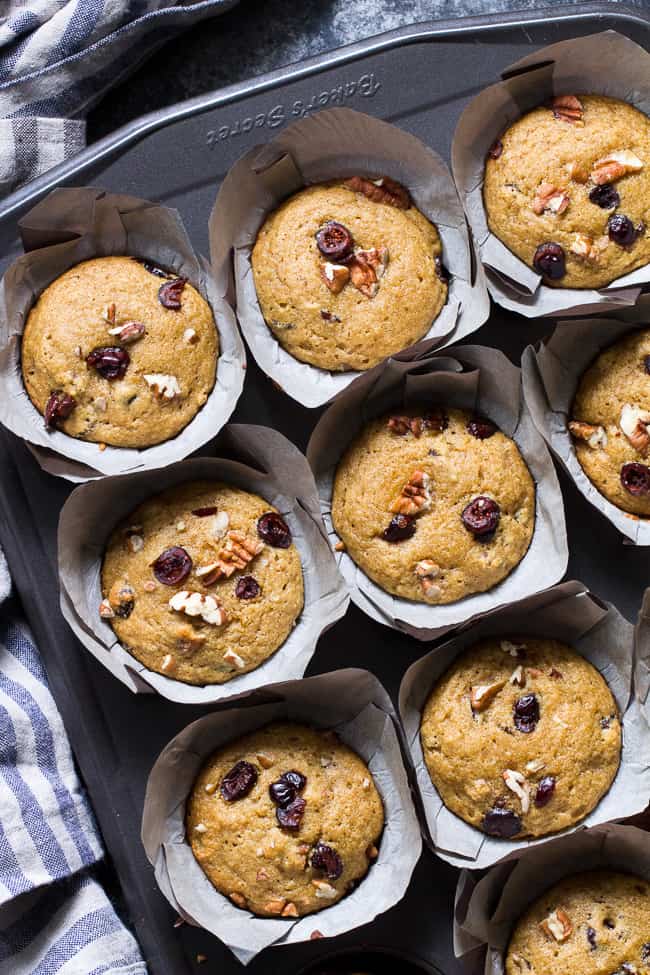 These soft, moist, and flavorful paleo cranberry orange muffins are studded with pecans and spiced just right! Great for the holidays or year round, these muffins are kid approved, gluten free, dairy free, and refined sugar free.