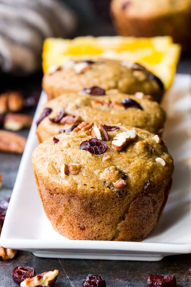 These soft, moist, and flavorful paleo cranberry orange muffins are studded with pecans and spiced just right! Great for the holidays or year round, these muffins are kid approved, gluten free, dairy free, and refined sugar free.