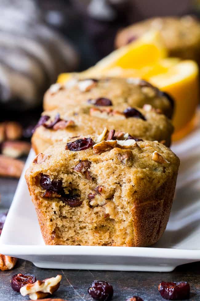 These soft, moist, and flavorful paleo cranberry orange muffins are studded with pecans and spiced just right! Great for the holidays or year round, these muffins are kid approved, gluten free, dairy free, and refined sugar free.