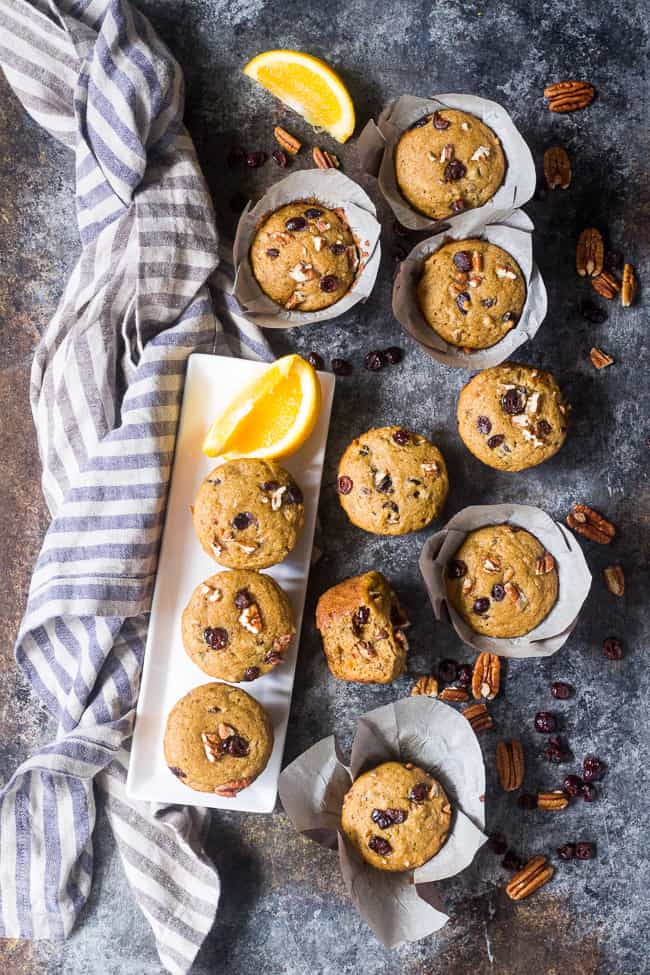 These soft, moist, and flavorful paleo cranberry orange muffins are studded with pecans and spiced just right! Great for the holidays or year round, these muffins are kid approved, gluten free, dairy free, and refined sugar free.