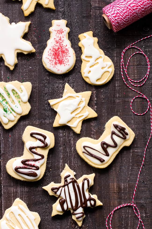 These easy cut-out Paleo Sugar Cookies are made with almond and coconut flour and sweetened with honey.  The perfect sugar cookies for the holidays that no one will guess are Paleo.  Grain free, refined sugar free, kid approved!