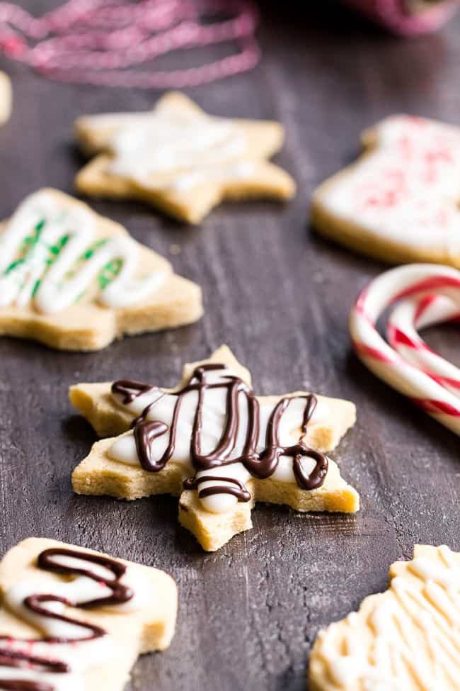 These easy cut-out Paleo Sugar Cookies are made with almond and coconut flour and sweetened with honey.  The perfect sugar cookies for the holidays that no one will guess are Paleo.  Grain free, refined sugar free, kid approved!