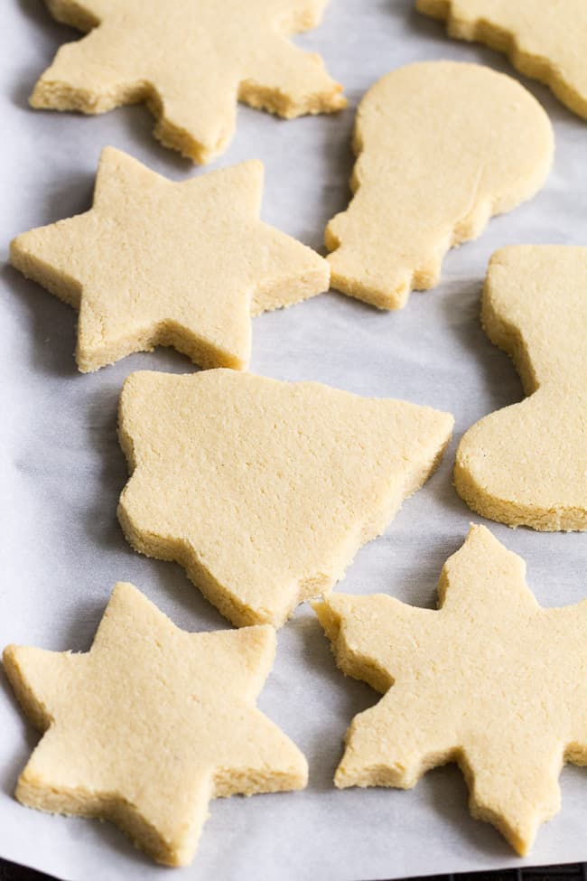 These easy cut-out Paleo Sugar Cookies are made with almond and coconut flour and sweetened with honey.  The perfect sugar cookies for the holidays that no one will guess are Paleo.  Grain free, refined sugar free, kid approved!