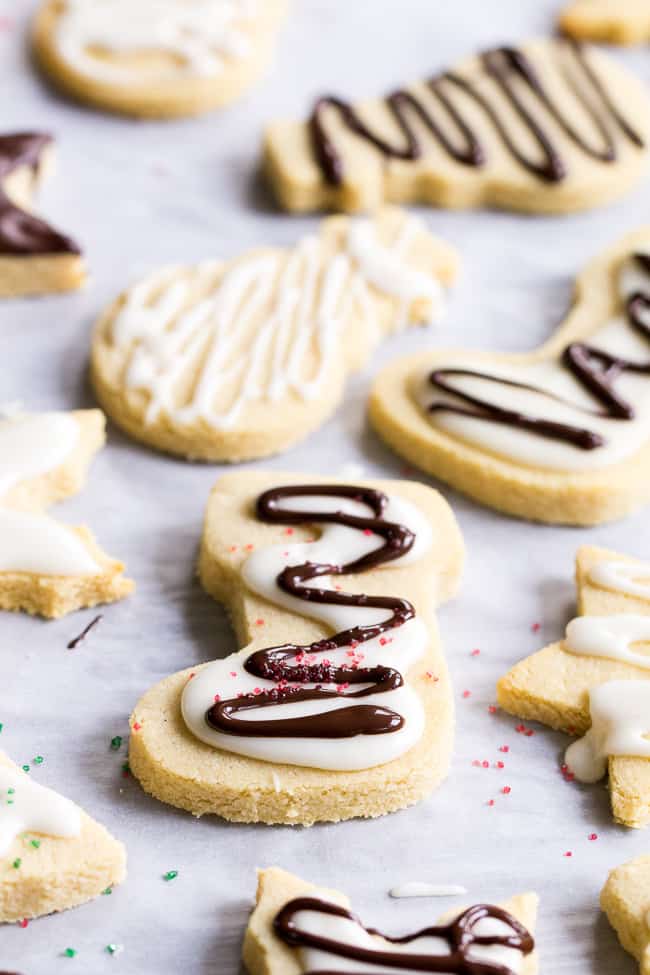 These easy cut-out Paleo Sugar Cookies are made with almond and coconut flour and sweetened with honey.  The perfect sugar cookies for the holidays that no one will guess are Paleo.  Grain free, refined sugar free, kid approved!