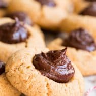 round tan almond butter cookies with chocolate fudge centers
