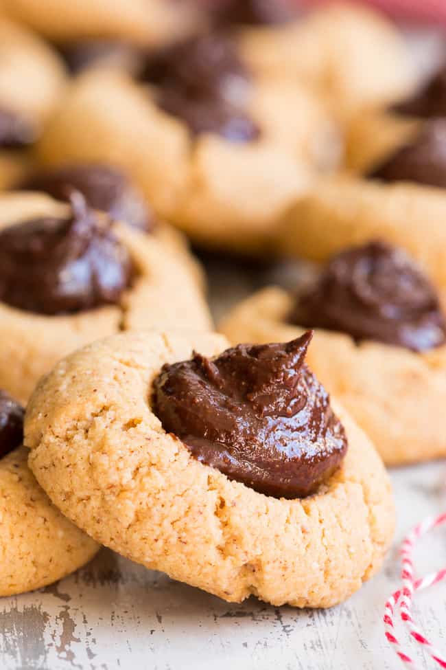 round tan almond butter cookies with chocolate fudge centers