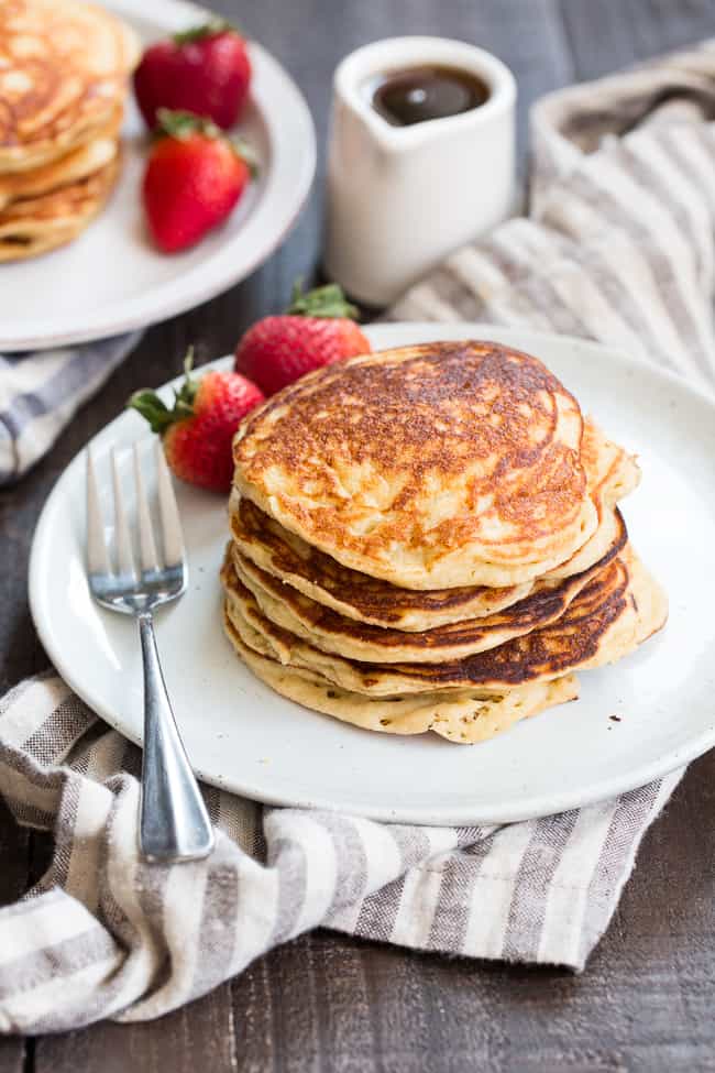 These fluffy paleo buttermilk pancakes are the perfect healthy answer to your pancake cravings! They come together quickly and are a hit with kids and adults alike. Grain free, nut free, dairy free and even freezable, which makes them great for breakfast or brunch any day of the week!