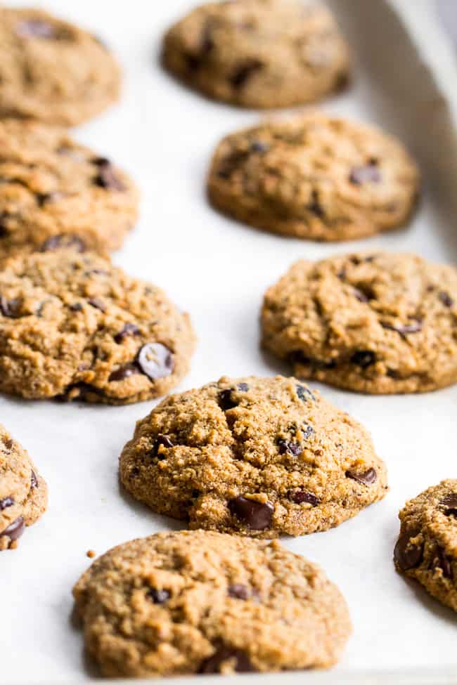 These cranberry orange chewy chocolate chip cookies might just become your favorite cookies, ever!  They're grain free yet have a thick and chewy "oatmeal" texture, and are also egg free, dairy free, paleo and vegan.  Super kid friendly and perfect for the holidays or anytime!