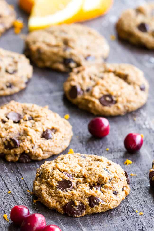 These cranberry orange chewy chocolate chip cookies might just become your favorite cookies, ever!  They're grain free yet have a thick and chewy "oatmeal" texture, and are also egg free, dairy free, paleo and vegan.  Super kid friendly and perfect for the holidays or anytime!