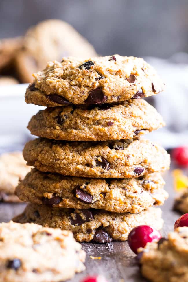 These cranberry orange chewy chocolate chip cookies might just become your favorite cookies, ever!  They're grain free yet have a thick and chewy "oatmeal" texture, and are also egg free, dairy free, paleo and vegan.  Super kid friendly and perfect for the holidays or anytime!