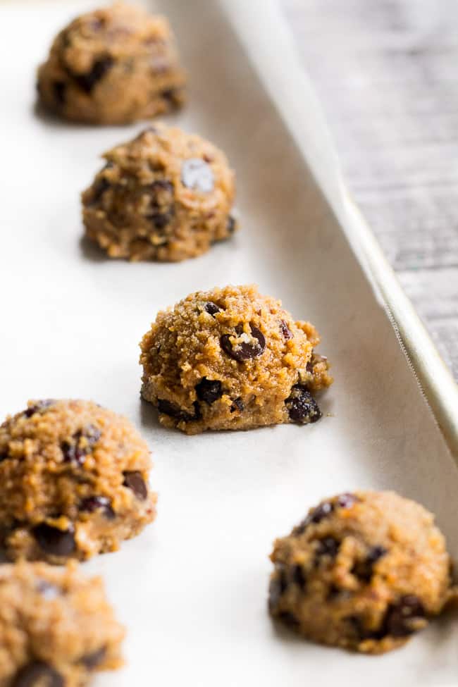 These cranberry orange chewy chocolate chip cookies might just become your favorite cookies, ever!  They're grain free yet have a thick and chewy "oatmeal" texture, and are also egg free, dairy free, paleo and vegan.  Super kid friendly and perfect for the holidays or anytime!
