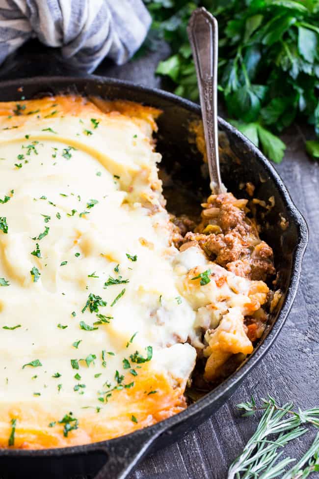 This Shepherd's Pie is classic, cozy comfort food for cold winter days!  It's paleo and Whole30 compliant, dairy free and kid approved.  A flavorful, hearty ground beef mixture is topped with creamy dairy-free mashed potatoes, and baked until golden brown and bubbling.  