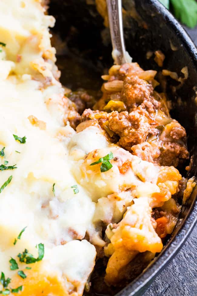 This Shepherd's Pie is classic, cozy comfort food for cold winter days!  It's paleo and Whole30 compliant, dairy free and kid approved.  A flavorful, hearty ground beef mixture is topped with creamy dairy-free mashed potatoes, and baked until golden brown and bubbling.  