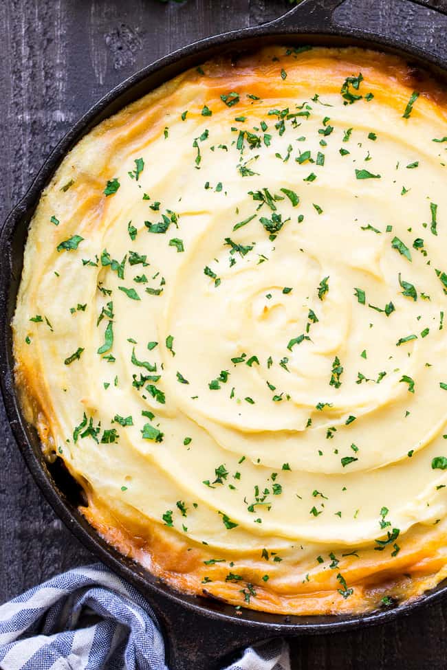 This Shepherd's Pie is classic, cozy comfort food for cold winter days!  It's paleo and Whole30 compliant, dairy free and kid approved.  A flavorful, hearty ground beef mixture is topped with creamy dairy-free mashed potatoes, and baked until golden brown and bubbling.  