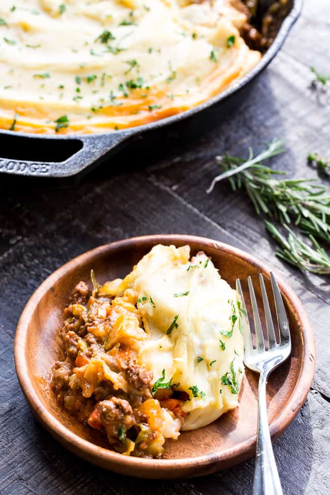 This Shepherd's Pie is classic, cozy comfort food for cold winter days!  It's paleo and Whole30 compliant, dairy free and kid approved.  A flavorful, hearty ground beef mixture is topped with creamy dairy-free mashed potatoes, and baked until golden brown and bubbling.  