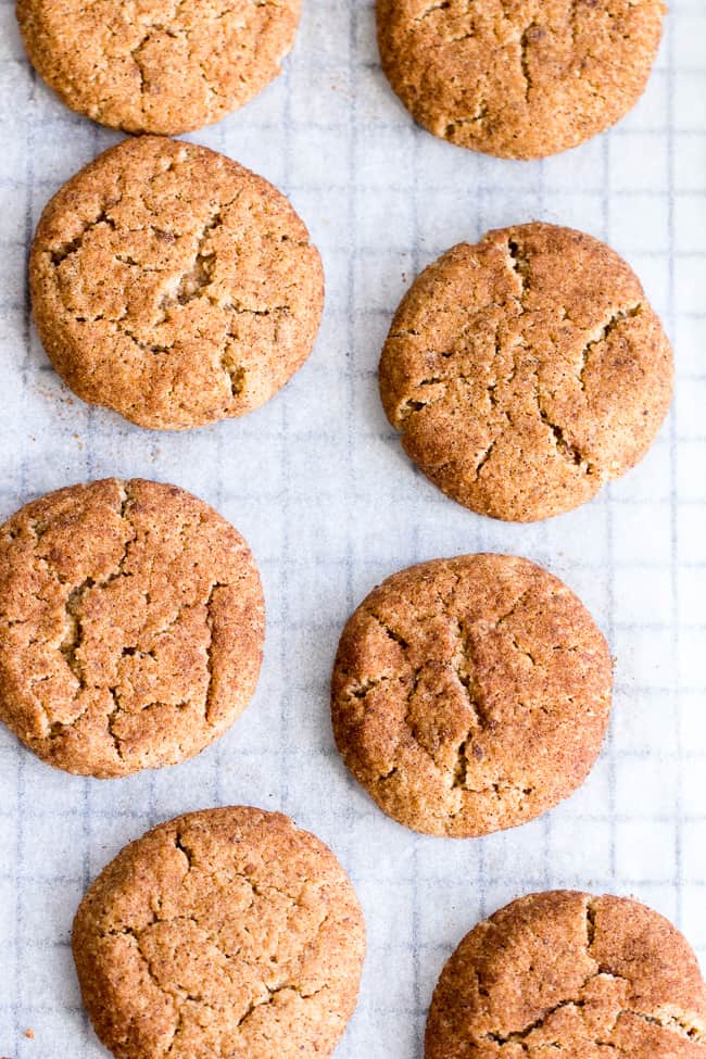 These super chewy, thick and soft paleo and vegan snickerdoodles are deliciously addicting, kid approved, and great for holiday cookie season or anytime a craving hits!  Dairy free, egg free, grain free, gluten free, paleo and vegan. 