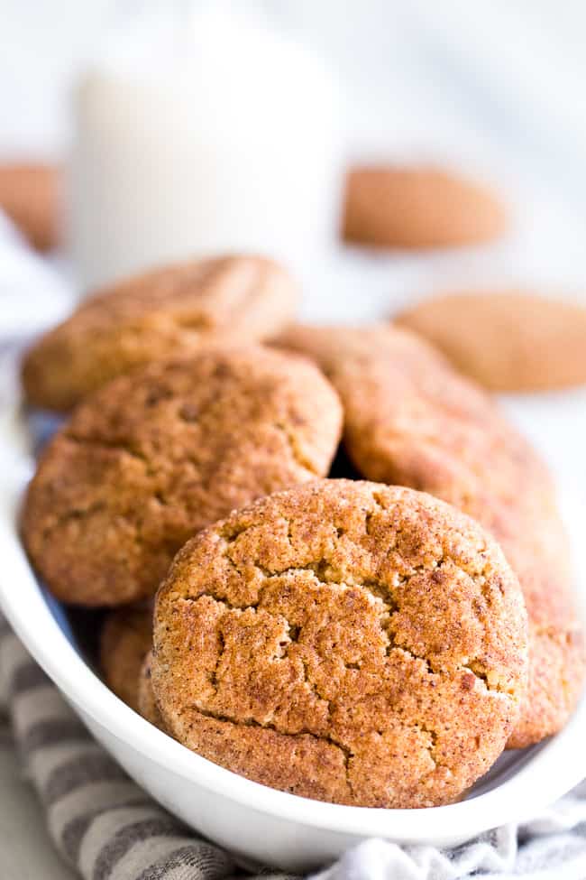 These super chewy, thick and soft paleo and vegan snickerdoodles are deliciously addicting, kid approved, and great for holiday cookie season or anytime a craving hits!  Dairy free, egg free, grain free, gluten free, paleo and vegan. 