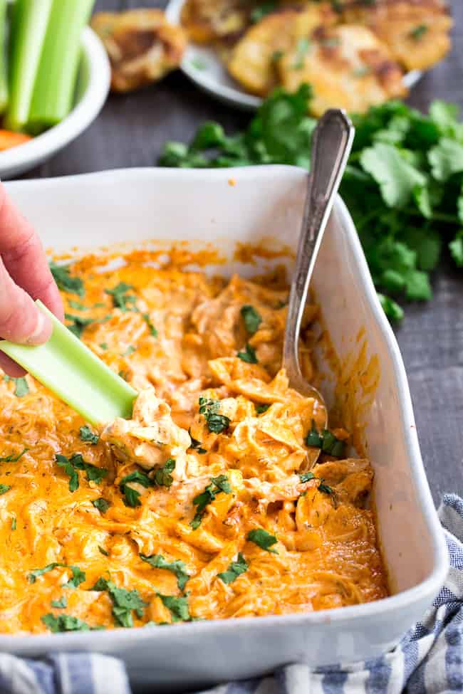 Perfectly creamy and packed with spice and flavor, this buffalo chicken dip is so ridiculously tasty that you'd never guess it's Paleo, Whole30 compliant, dairy-free, and keto friendly!  Use as a dip for veggies, tostones, or as a topping for sweet potato toast or a baked potato to make it a full meal!