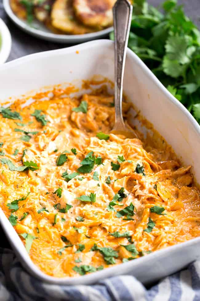 Perfectly creamy and packed with spice and flavor, this buffalo chicken dip is so ridiculously tasty that you'd never guess it's Paleo, Whole30 compliant, dairy-free, and keto friendly!  Use as a dip for veggies, tostones, or as a topping for sweet potato toast or a baked potato to make it a full meal!