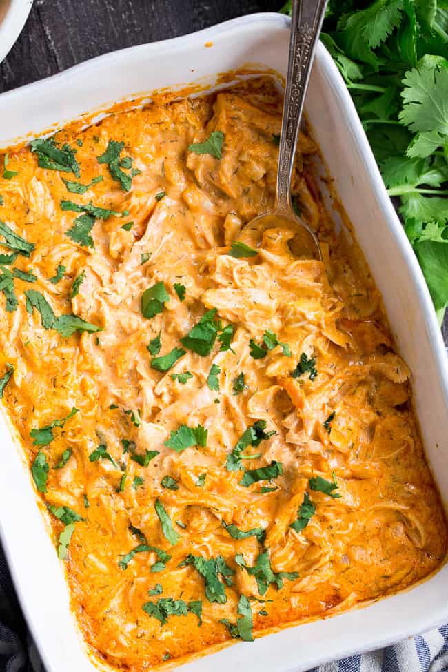 Perfectly creamy and packed with spice and flavor, this buffalo chicken dip is so ridiculously tasty that you'd never guess it's Paleo, Whole30 compliant, dairy-free, and keto friendly!  Use as a dip for veggies, tostones, or as a topping for sweet potato toast or a baked potato to make it a full meal!