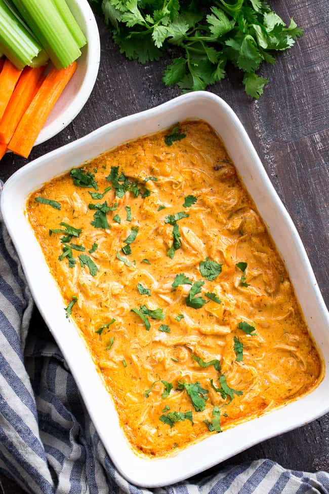 Perfectly creamy and packed with spice and flavor, this buffalo chicken dip is so ridiculously tasty that you'd never guess it's Paleo, Whole30 compliant, dairy-free, and keto friendly!  Use as a dip for veggies, tostones, or as a topping for sweet potato toast or a baked potato to make it a full meal!
