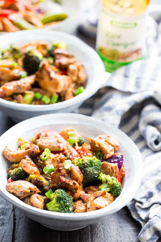 This easy chicken stir fry is better than takeout, so much healthier and quick to throw together for a weeknight dinner.  The garlic sauce is packed with flavor and made with Paleo and Whole30 friendly ingredients.  Delicious served alone or over fried cauliflower rice, kid approved and packed with veggies!