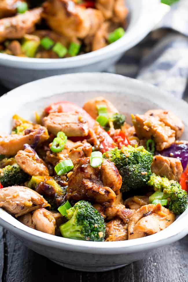 This easy chicken stir fry is better than takeout, so much healthier and quick to throw together for a weeknight dinner.  The garlic sauce is packed with flavor and made with Paleo and Whole30 friendly ingredients.  Delicious served alone or over fried cauliflower rice, kid approved and packed with veggies!