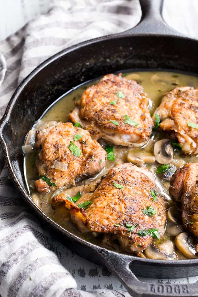 This creamy chicken with mushrooms is made all in one pan, packed with flavor, dairy free, paleo, keto and Whole30 compliant!  Seasoned crispy skinned chicken thighs with a dairy free mushroom sauce that's perfect over cauliflower rice or with roasted and veggies.