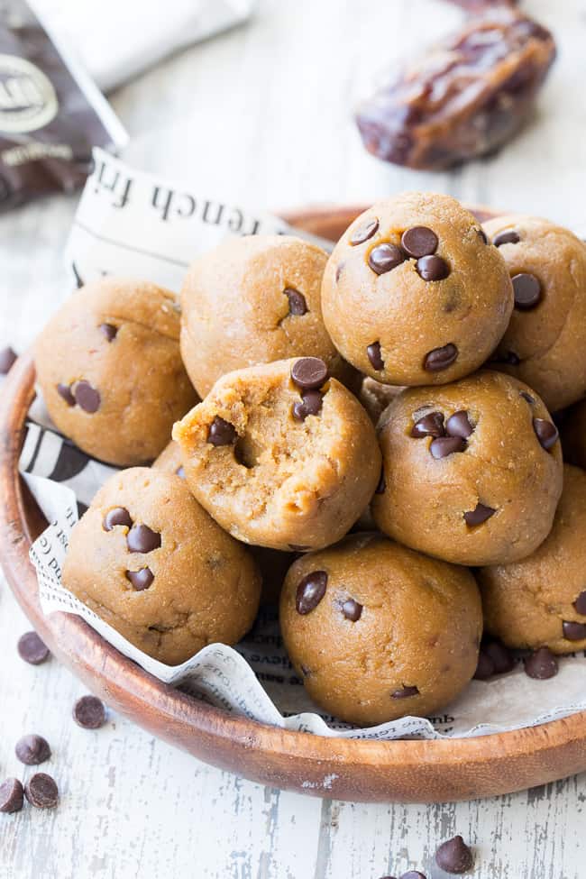 These tasty no-bake Paleo cookie dough bites are made with real-food ingredients, sweetened with dates and bananas and pack a punch of Paleo friendly protein along with the taste and texture of chocolate chip cookie dough!