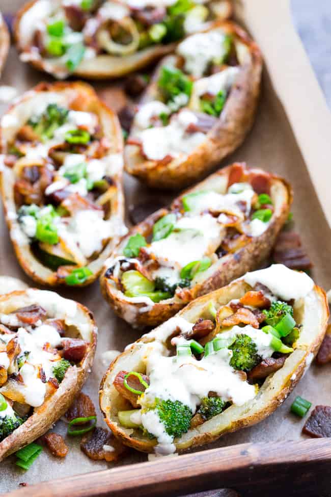 Yes - you can have crispy loaded potato skins while keeping things Whole30 and Paleo!  These crispy baked skins are loaded with roasted broccoli, caramelized onions, crisp bacon and drizzled all over with homemade ranch for tons of flavor with no dairy in sight.  Great as an appetizer or side dish, kid approved, easy to make!