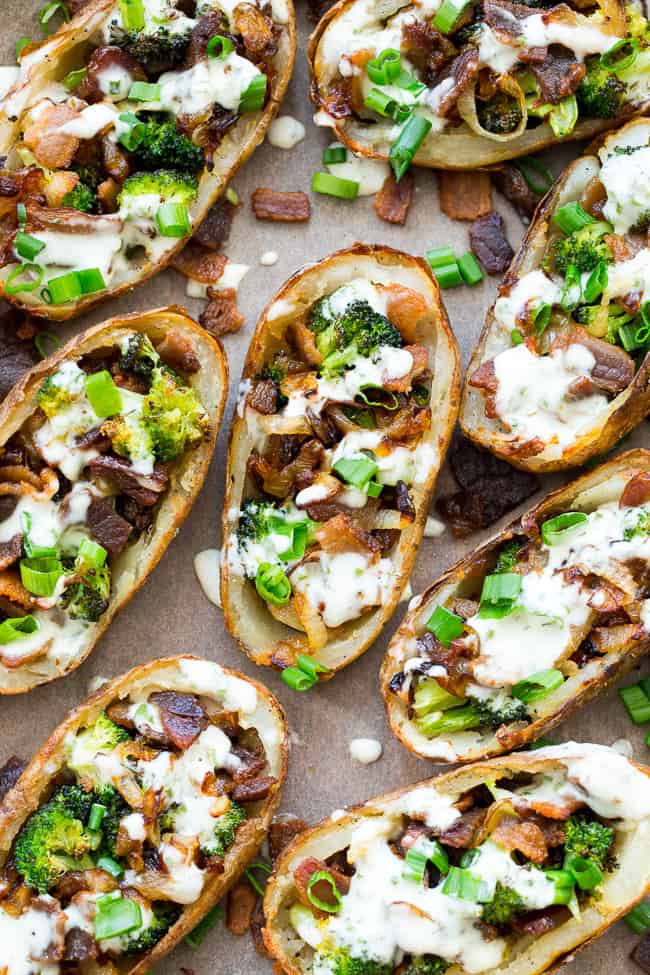 Yes - you can have crispy loaded potato skins while keeping things Whole30 and Paleo!  These crispy baked skins are loaded with roasted broccoli, caramelized onions, crisp bacon and drizzled all over with homemade ranch for tons of flavor with no dairy in sight.  Great as an appetizer or side dish, kid approved, easy to make!