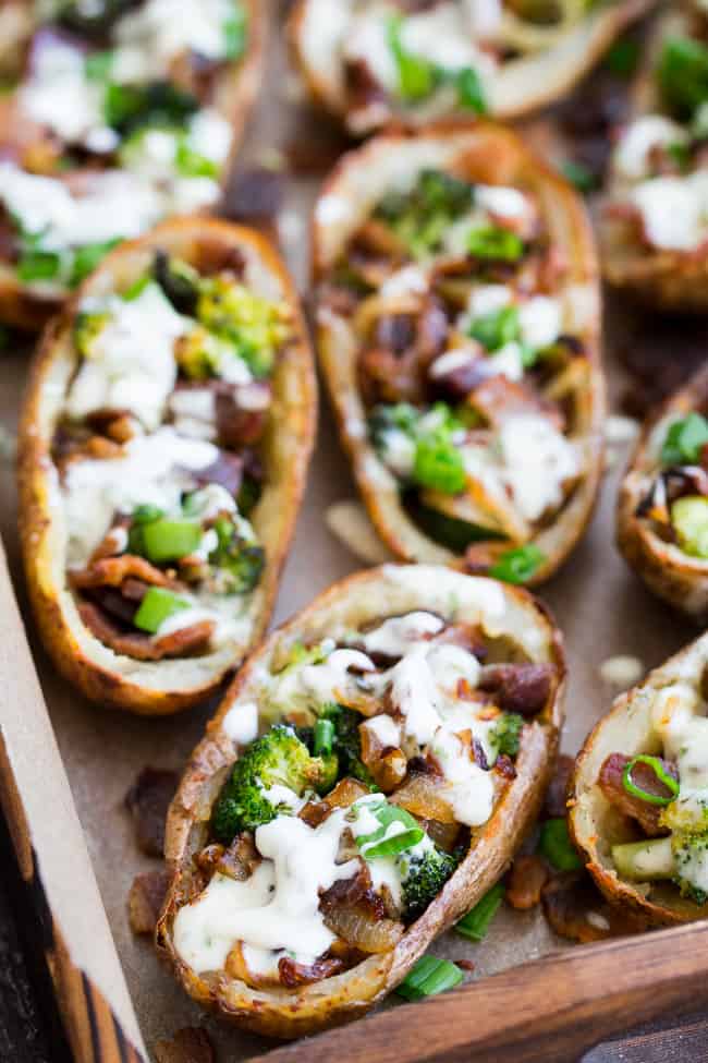 Yes - you can have crispy loaded potato skins while keeping things Whole30 and Paleo!  These crispy baked skins are loaded with roasted broccoli, caramelized onions, crisp bacon and drizzled all over with homemade ranch for tons of flavor with no dairy in sight.  Great as an appetizer or side dish, kid approved, easy to make!