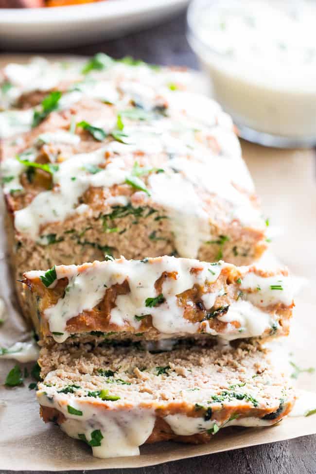 This Veggie Ranch Turkey Meatloaf is packed with zesty ranch flavor, spinach and onions, and topped with zesty dairy free, Paleo and Whole30 ranch sauce!  Delicious with roasted sweet potatoes, greens and avocado.  Family approved, grain free, paleo and Whole30 compliant.