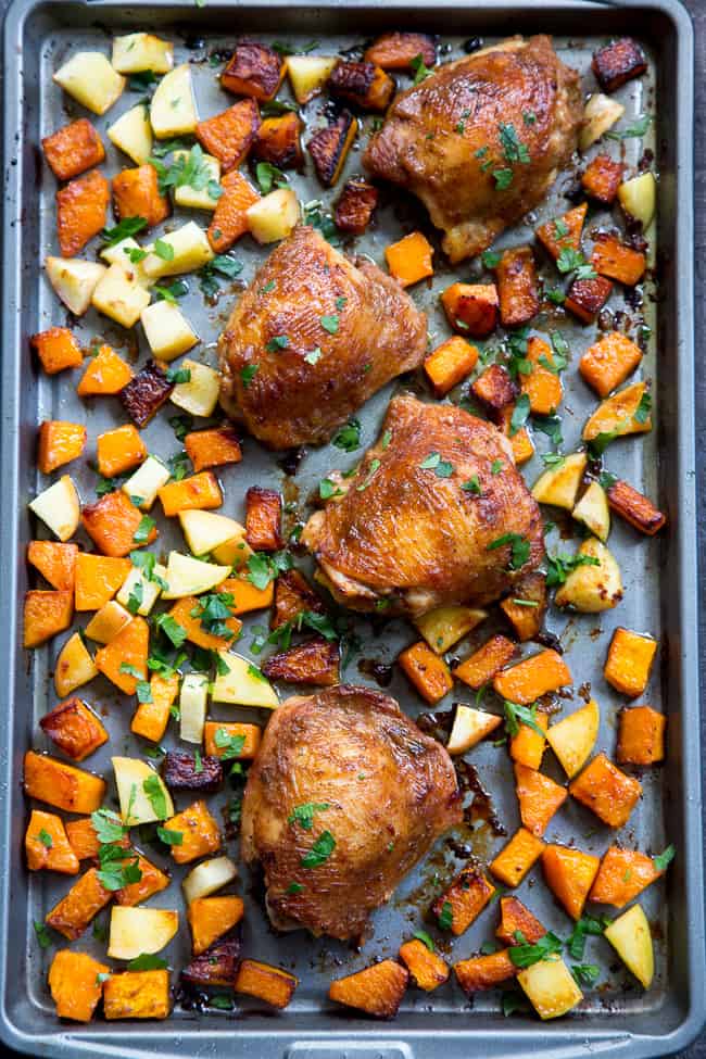 This savory and sweet glazed sheet pan chicken with butternut squash and apples is the perfect no-fuss, one-pan paleo and Whole30 dinner.  With a date-sweetened glaze, it's free of added sugar but packed with flavor and kid approved!