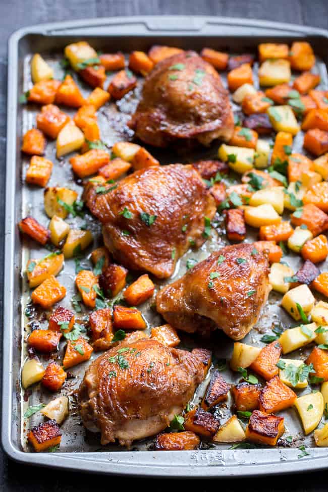 This savory and sweet glazed sheet pan chicken with butternut squash and apples is the perfect no-fuss, one-pan paleo and Whole30 dinner.  With a date-sweetened glaze, it's free of added sugar but packed with flavor and kid approved!