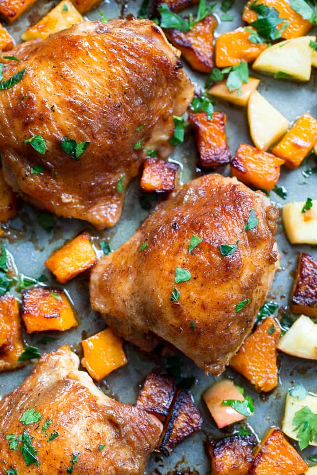 This savory and sweet glazed sheet pan chicken with butternut squash and apples is the perfect no-fuss, one-pan paleo and Whole30 dinner.  With a date-sweetened glaze, it's free of added sugar but packed with flavor and kid approved!