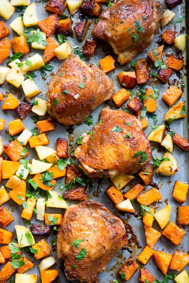 This savory and sweet glazed sheet pan chicken with butternut squash and apples is the perfect no-fuss, one-pan paleo and Whole30 dinner.  With a date-sweetened glaze, it's free of added sugar but packed with flavor and kid approved!